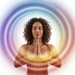 A person meditating with their hands in prayer position, surrounded by swirling energy. prayer, vibration, Law of Attraction Prayer, Vibration, Law of Attraction, Quantum, Spiritual Alignment, Manifestation, Energy, Intentions, Universe